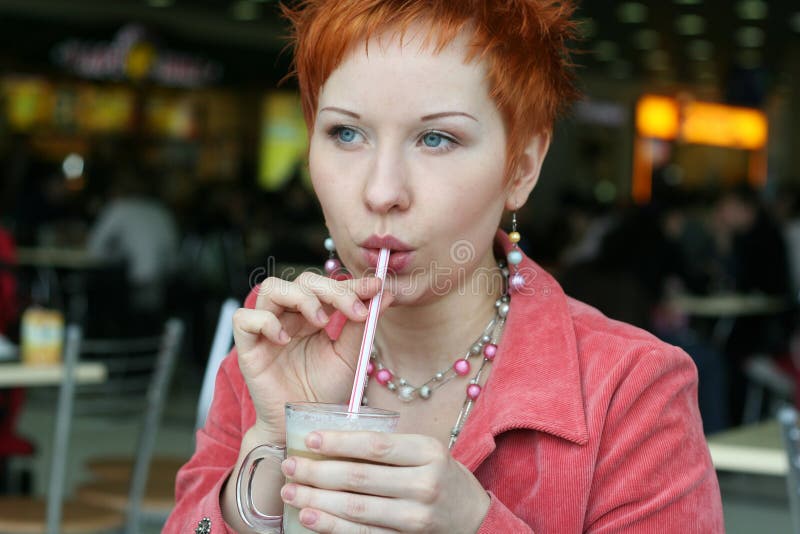 Woman drinking coffee in cafe