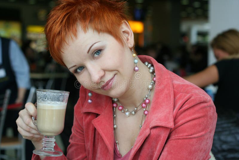 Woman drinking coffee in cafe