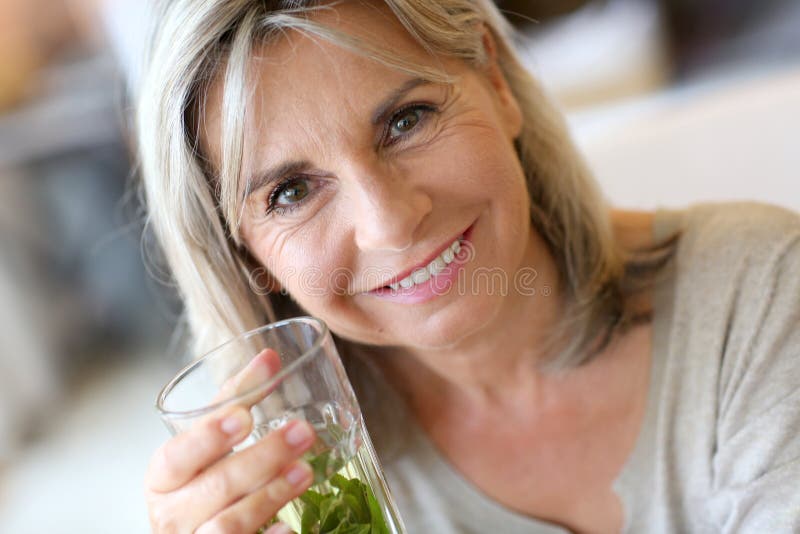 Woman drinking herbal infusion