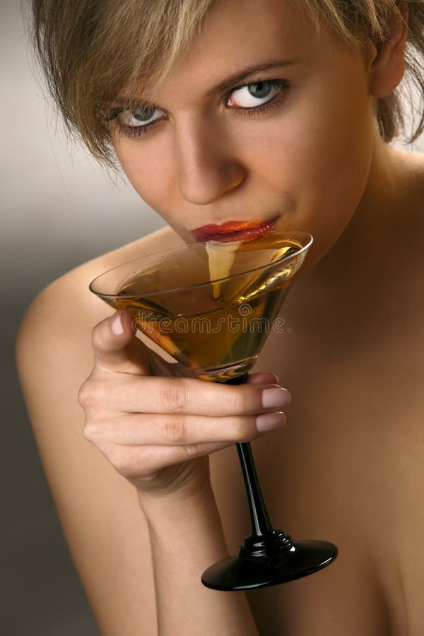 Woman drinking martini cocktail