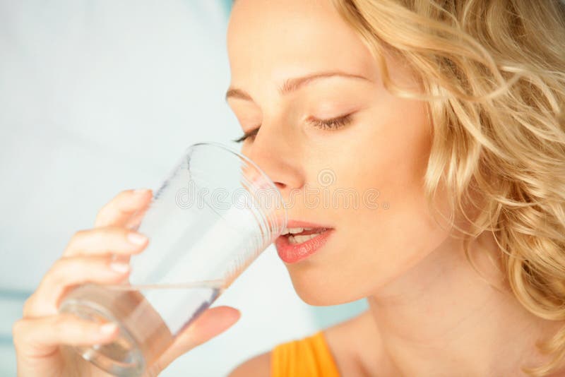 Woman drinking mineral water royalty free stock images Woman drinking mineral water royalty free stock images