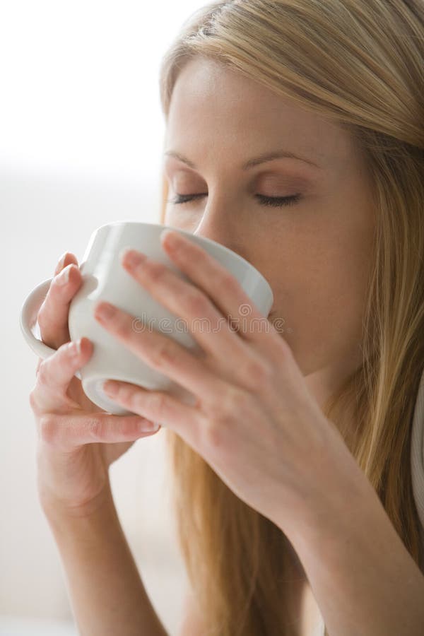 Woman drinking from a mug