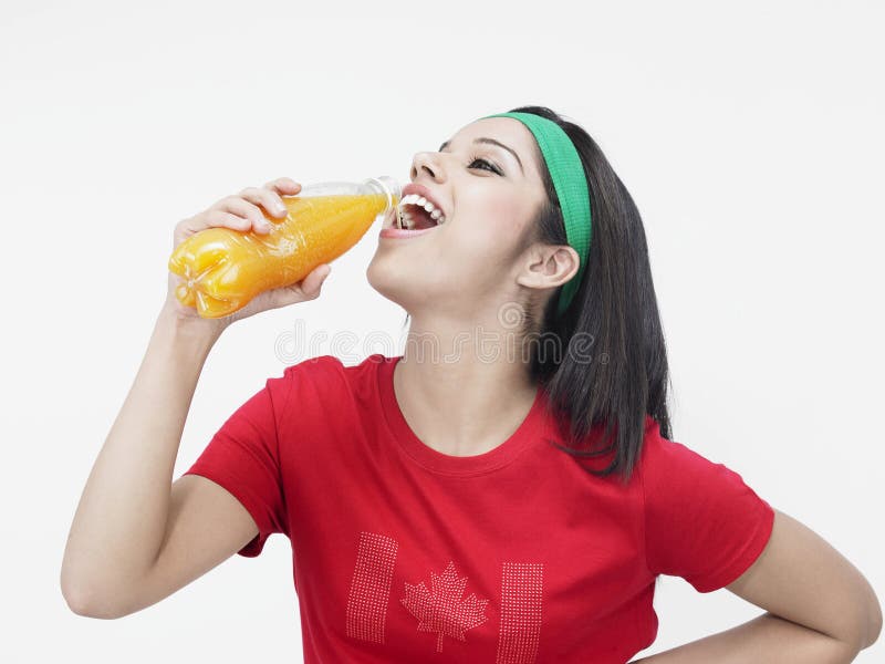 Woman drinking orange juice