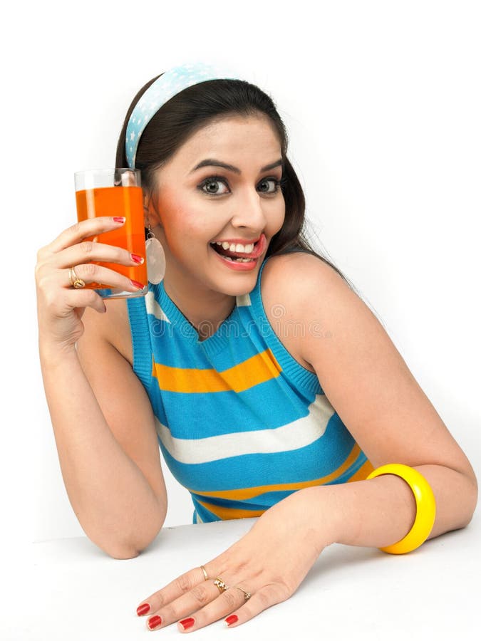 woman drinking orange juice