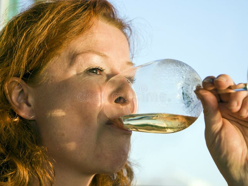 Woman drinking white wine stock image. Image of drinking 40960499