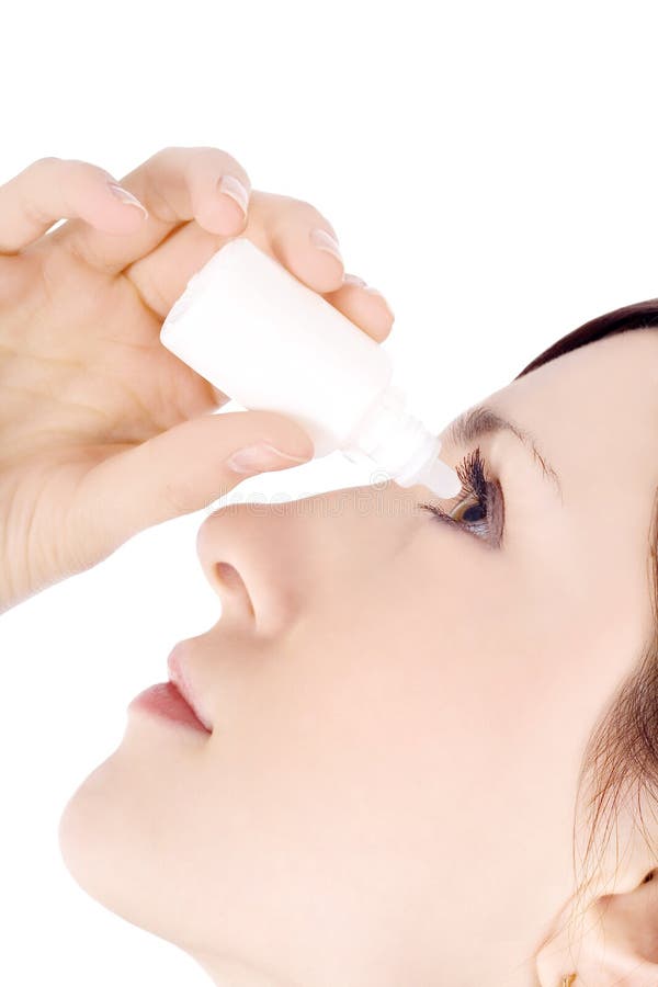 Woman dripping eye with eyes drops