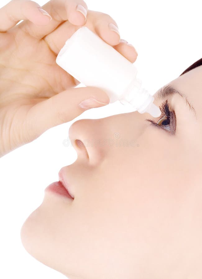 Woman dripping eye with eyes drops