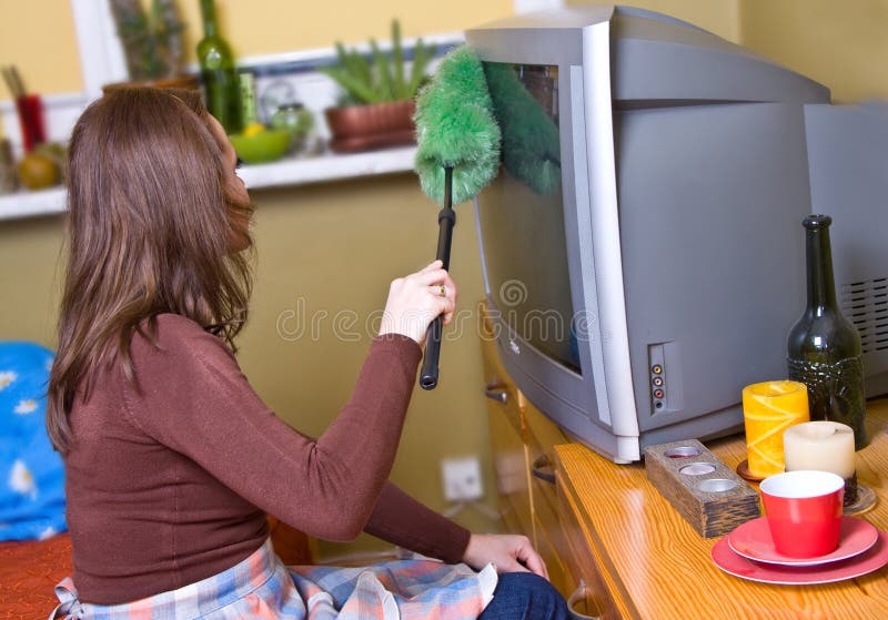 Woman is dusting stock image. Image of apron, working 4539795
