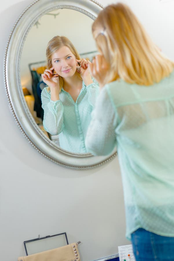 Woman with earrings royalty free stock photography