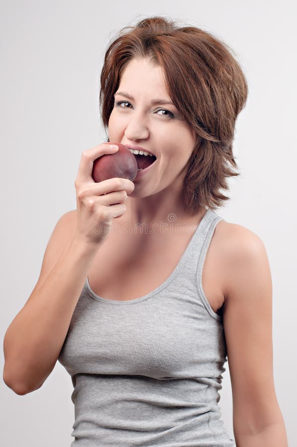 Woman eating stock photo. Image of peach, fruit, face - 17170008