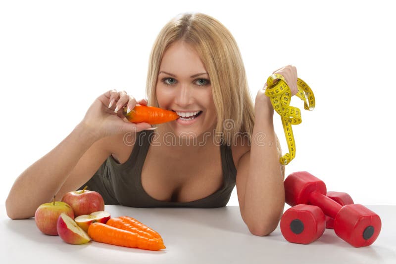 Woman eating carrot