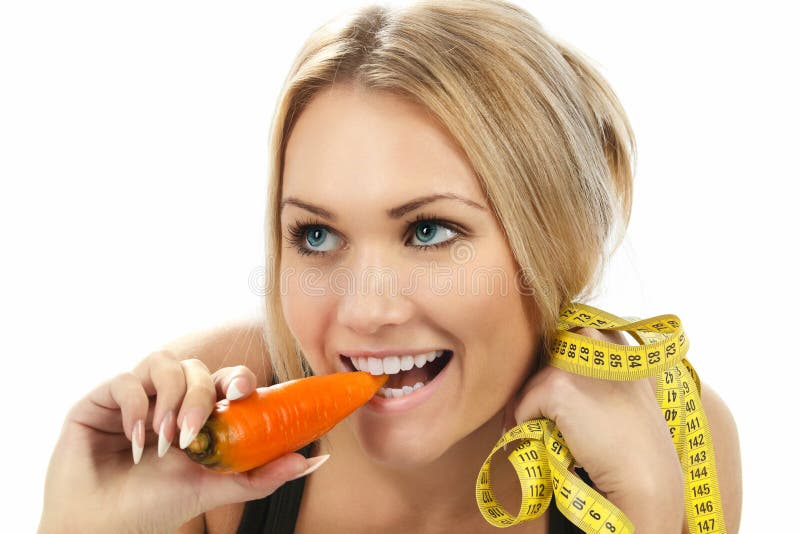 Woman eating carrot