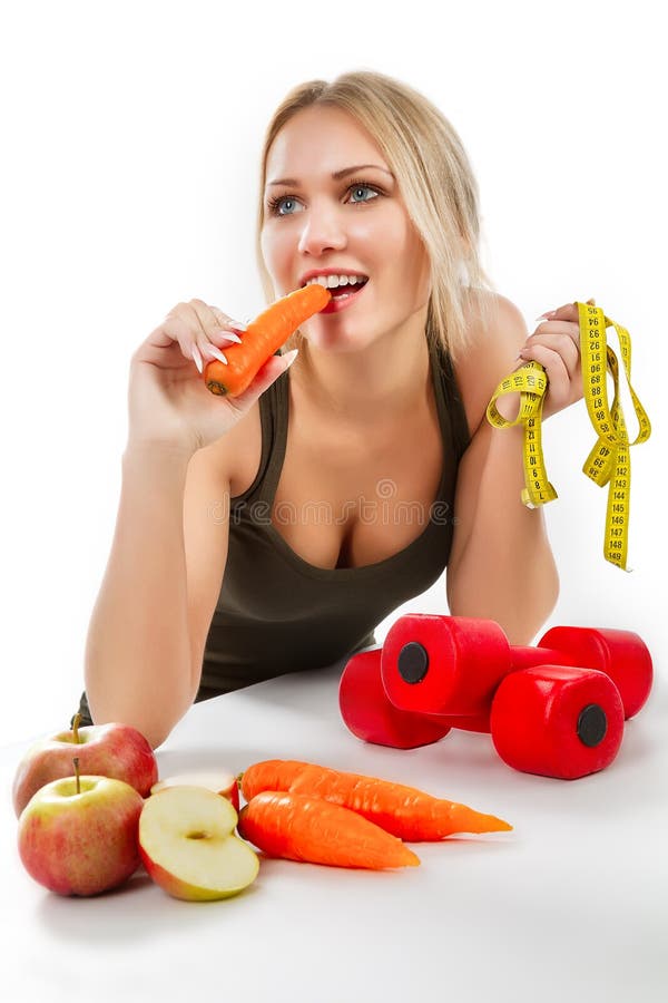 Woman eating carrot