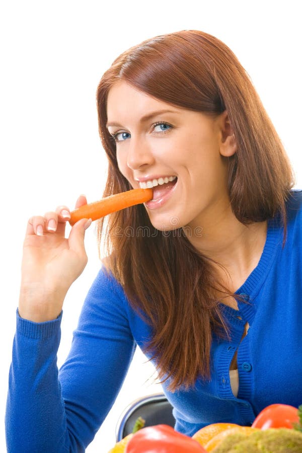 Woman eating carrots, isolated