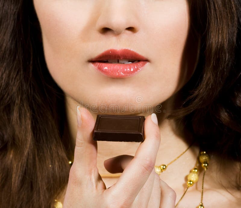 Woman eating chocolate