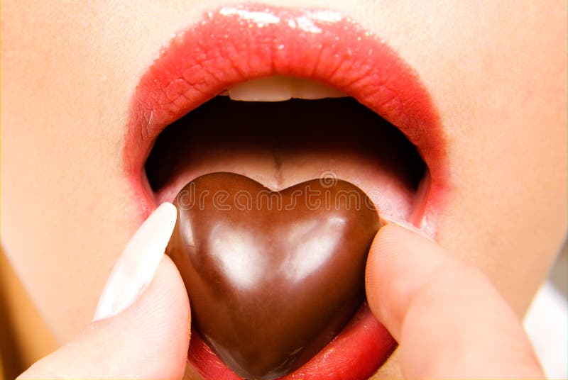 Woman eating chocolate candy