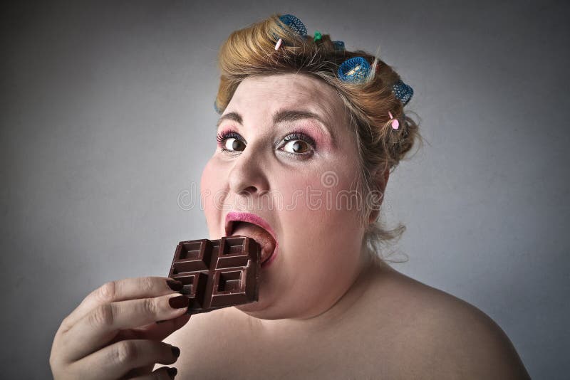 Woman eating chocolate stock photo. Image of hairstyle 