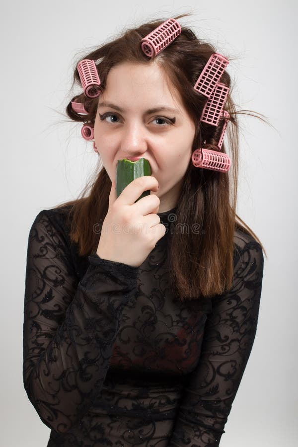 Woman eating cucumber royalty free stock photography Woman eating cucumber royalty free stock photography
