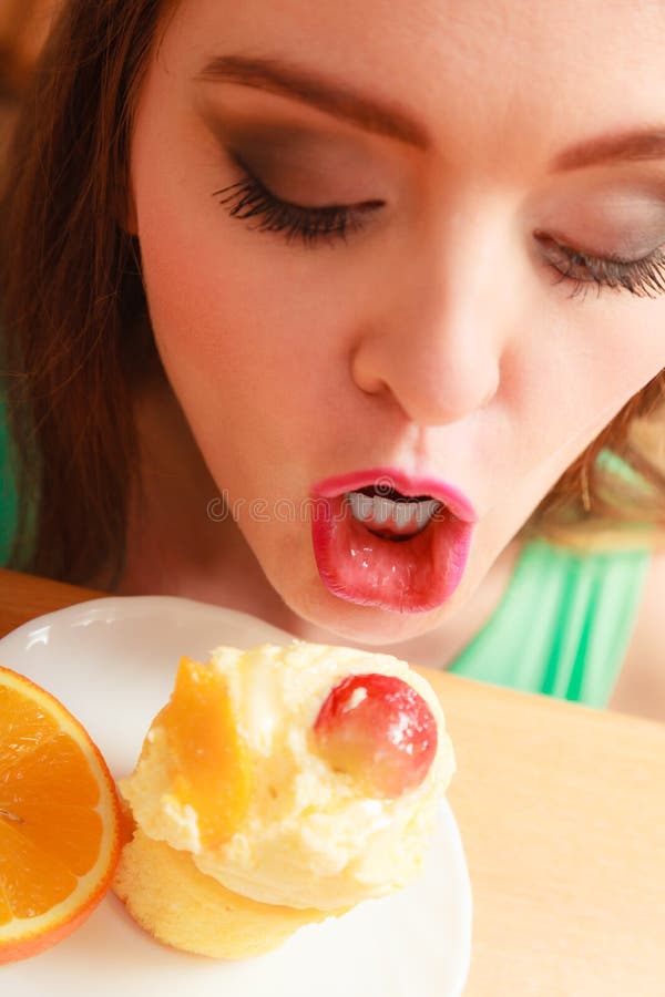 Woman eating delicious sweet cake. 