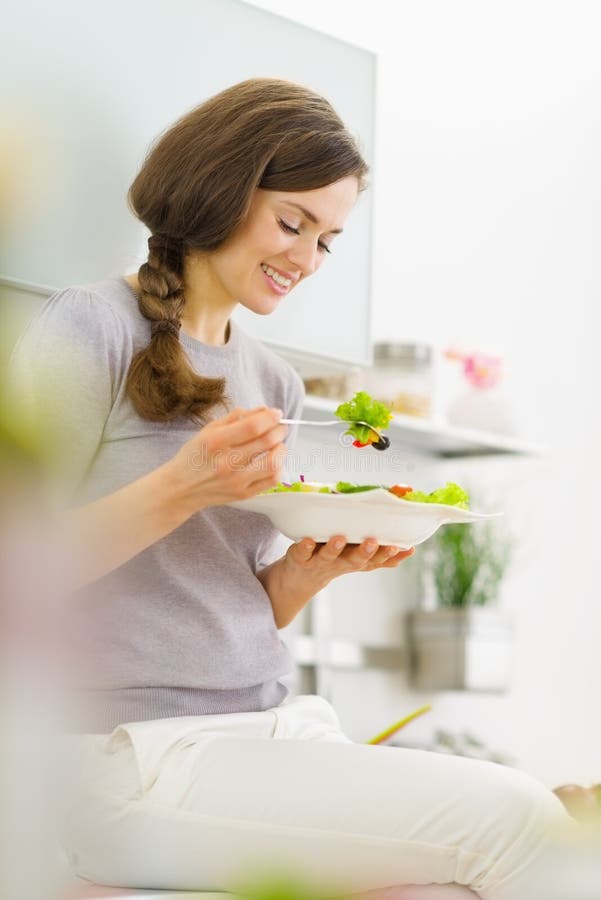 Woman Eating Fresh Salad in Kitchen Stock Image Image of healthy