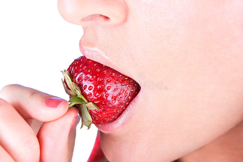 Woman are eating fresh strawberry