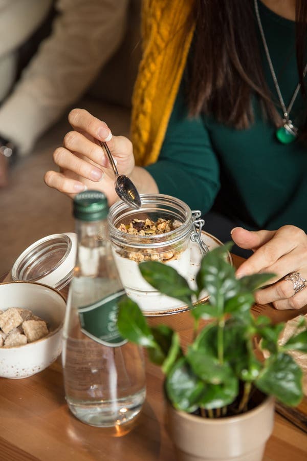 Granola And Curd Creamy Tzoghurt With Mint On A Dark Background. Top