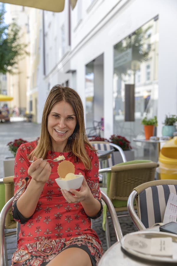 Woman eating ice cream outside on summer vacation stock images Woman eating ice cream outside on summer vacation stock images