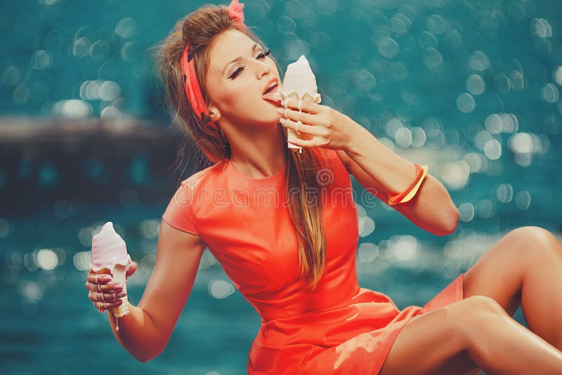 Woman eating melted ice-cream