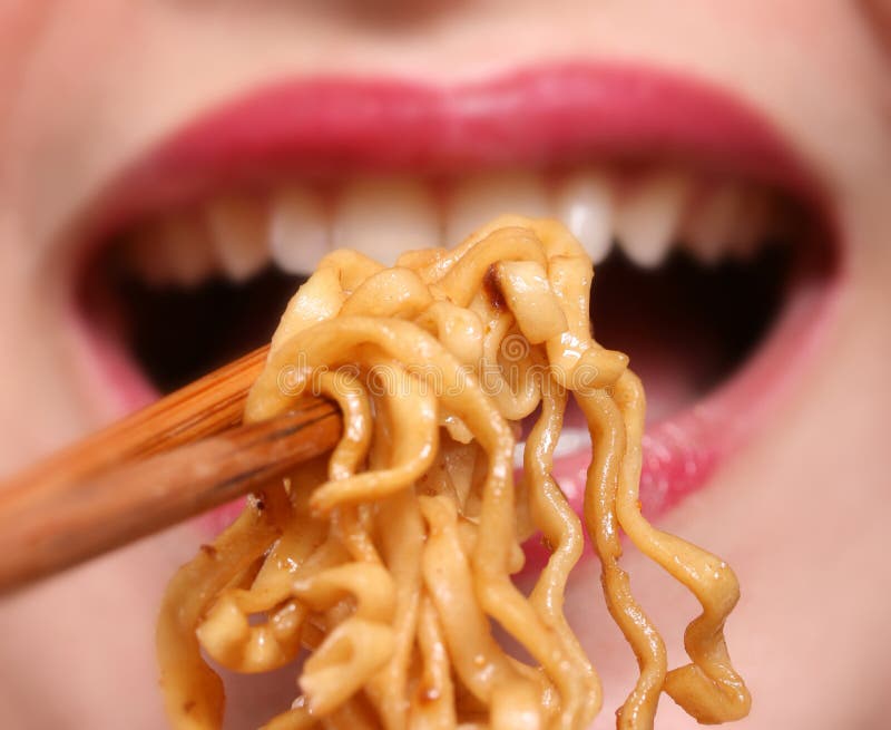 Woman eating noodles