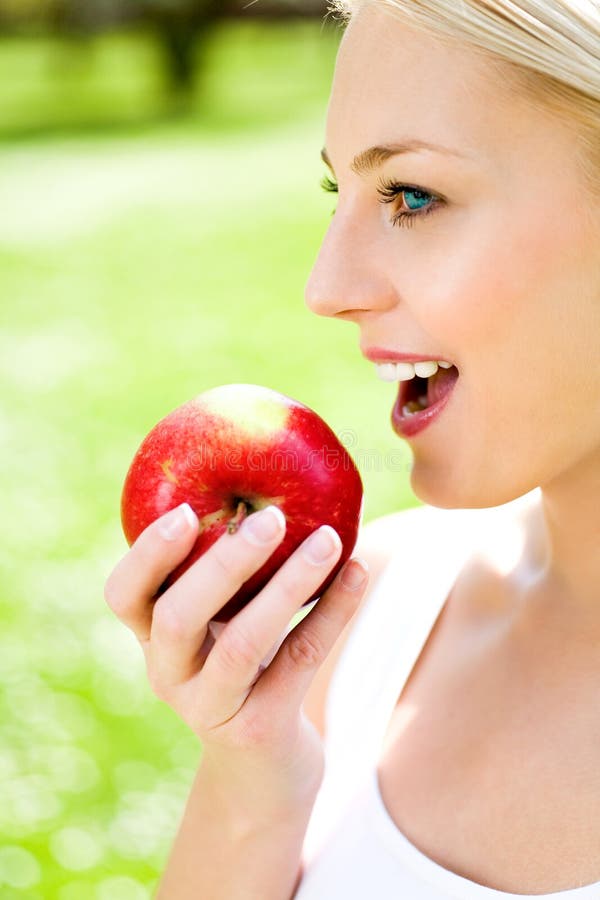 Woman eating red apple stock image. Image of tooth, apple 9140583