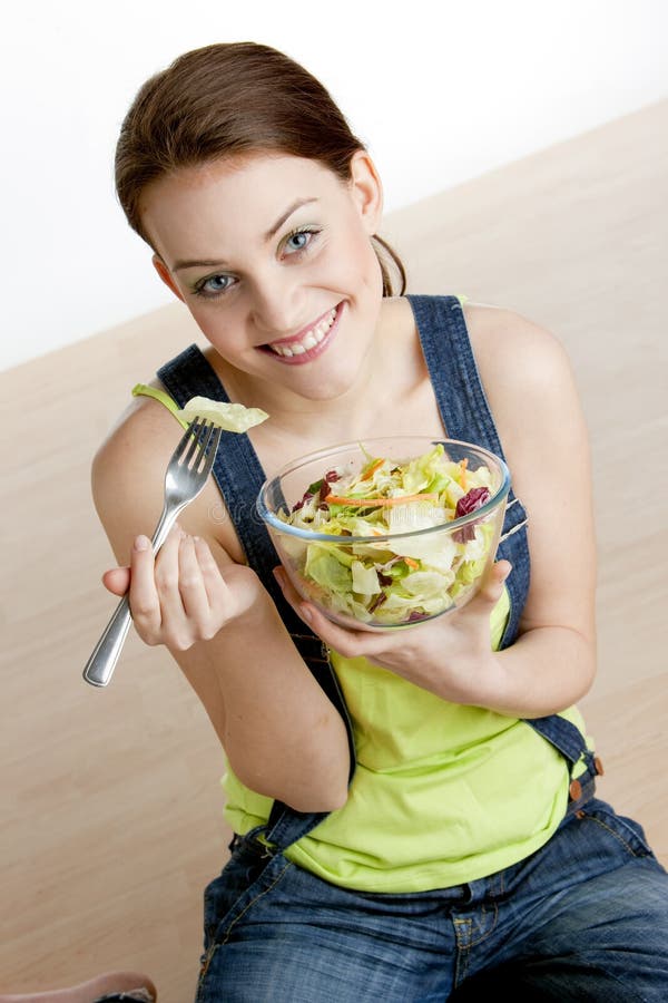 Woman eating salad