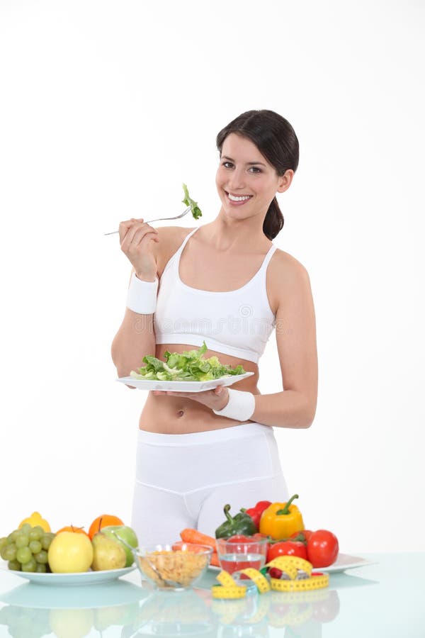 Woman eating salad leaves stock image. Image of nutritious 28641719