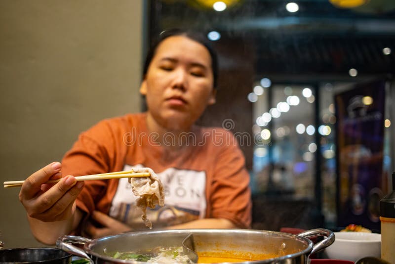 Asian Girl Smoking Blunt With Chopsticks