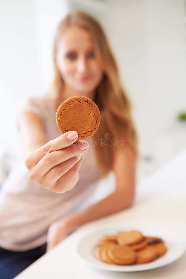 Woman Eats Ginger Biscuit To Stop Nausea of Morning Sickness Stock Photo Image of ginger