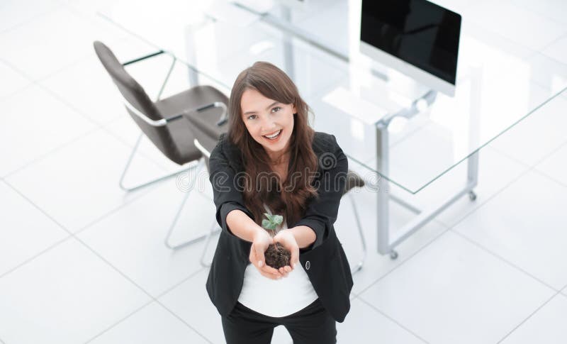 Woman ecologist shows you a fresh sprout royalty free stock image Woman ecologist shows you a fresh sprout royalty free stock image