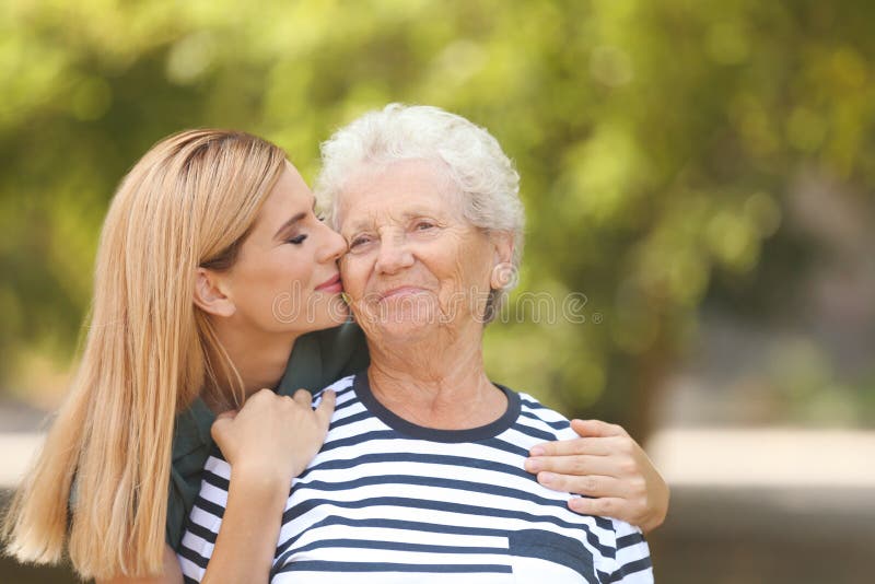 Woman with elderly mother outdoors stock image Woman with elderly mother outdoors stock image