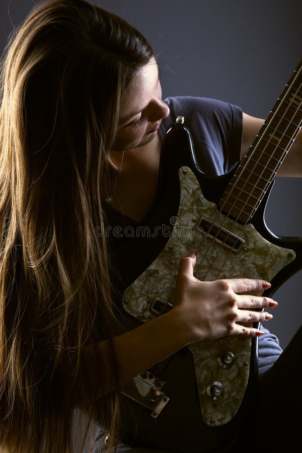 Woman with electric guitar