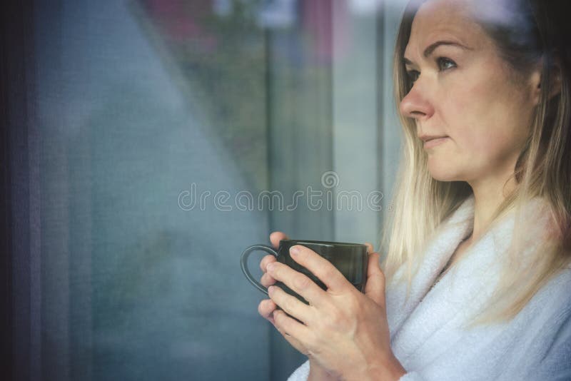 Woman in Elegant Robe Drinking Coffee in Hotel Room and Standing Near ...
