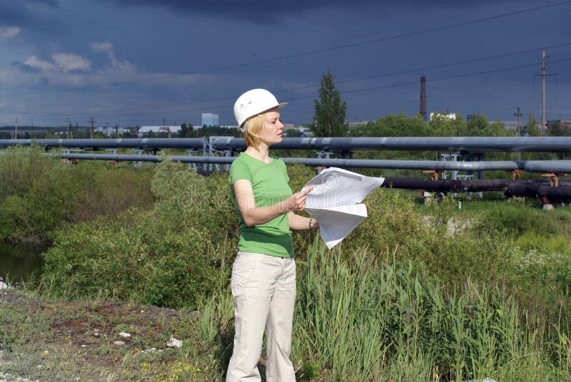 Woman engineer or architect with white safety hat
