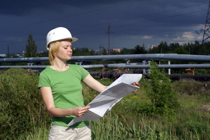 Woman engineer or architect with white safety hat