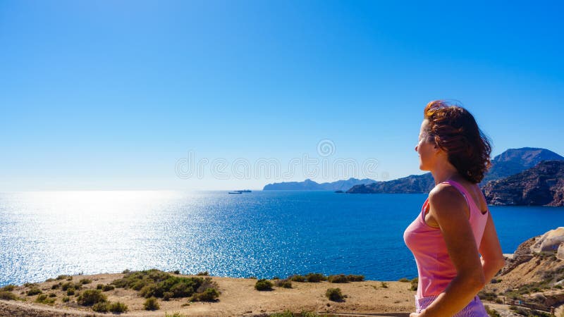 Woman enjoy sea breeze