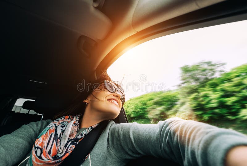 Woman enjoy with view from car window in traveling by auto stock photos Woman enjoy with view from car window in traveling by auto stock photos