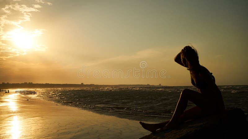 Profile of a Sad Young Woman Silhouette in Swimsuit Stock Image