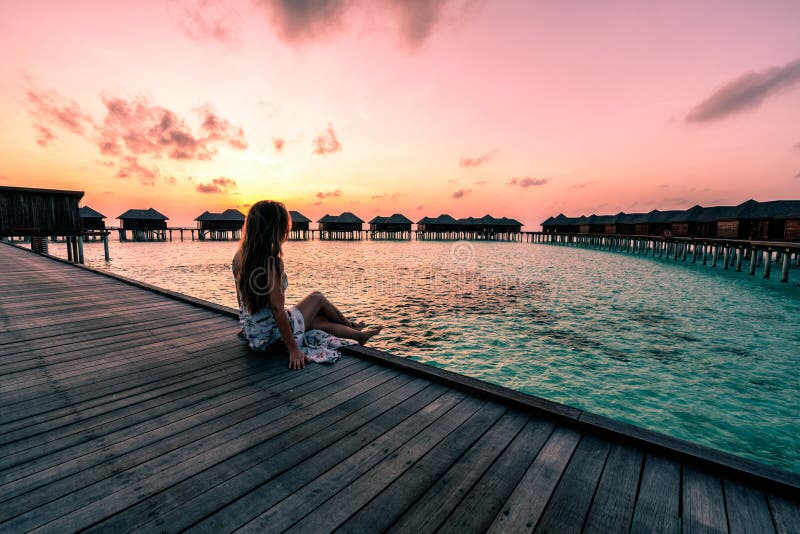 A Woman Enjoying a Sunrise in the Maldives Stock Image - Image of ...