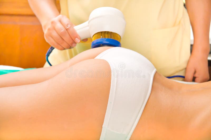 The Woman Came To the Procedure of Laser Hair Removal. the Doctor Treats  Her Buttock with a Device Stock Photo - Image of body, face: 105466982
