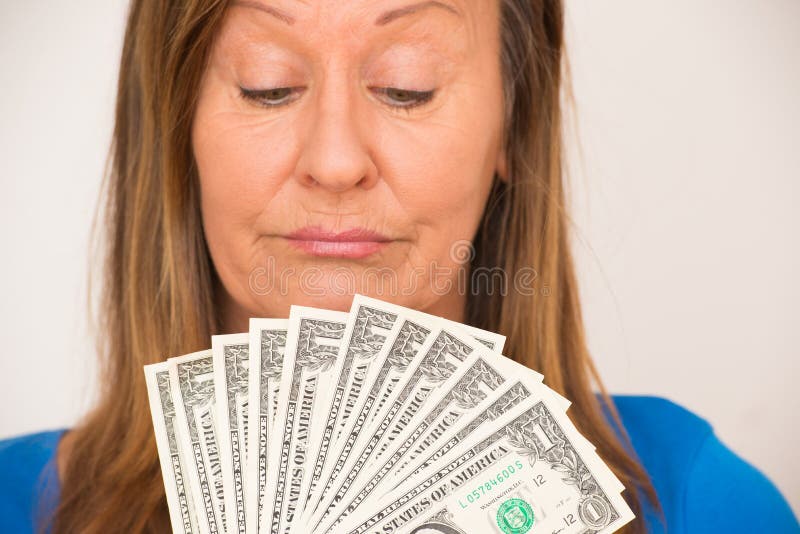 Woman enjoying us dollar notes