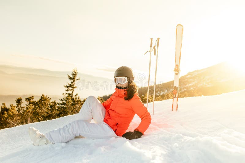 Woman enjoying the view from mountain slopes, relaxing