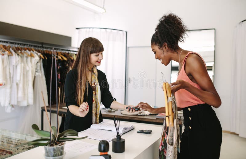 Woman Entrepreneur Making Sale in Her Fashion Studio Stock Image ...