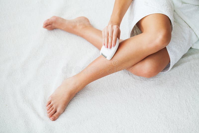 Woman with Epilator Removing Hair on Legs Stock Image Image of
