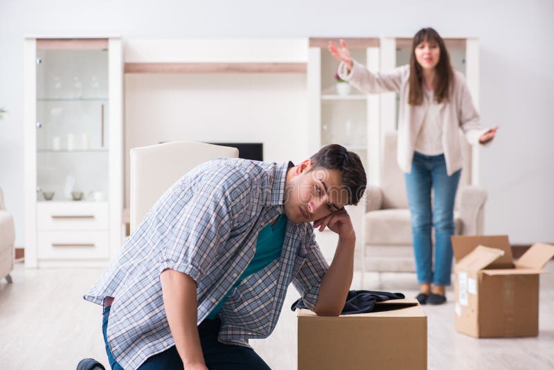 The woman evicting man from house during family conflict royalty free stock images The woman evicting man from house during family conflict royalty free stock images